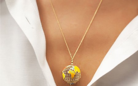 Ariş'ten dünya figürlü altın kolye